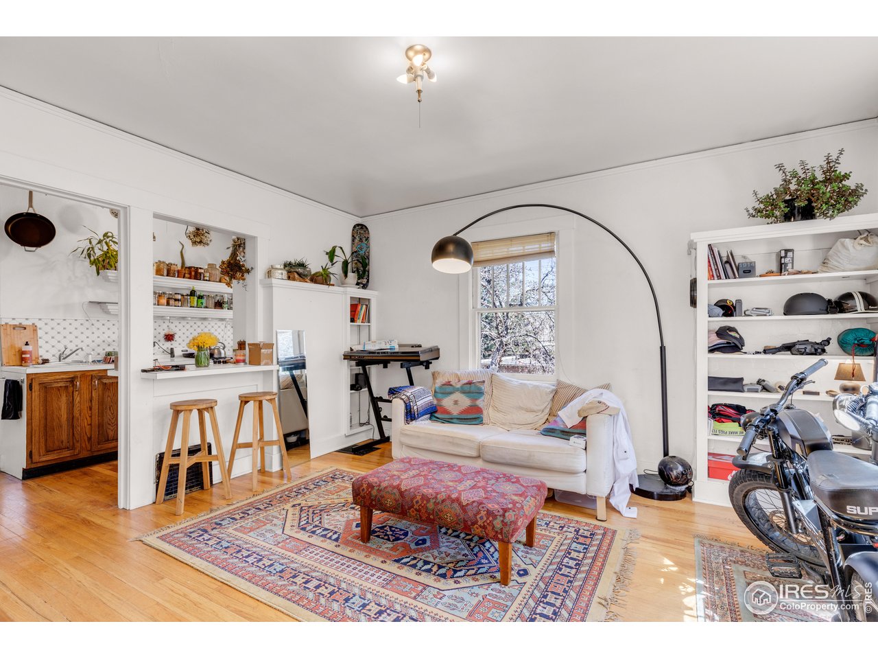 834-836 13th Street Boulder, CO 80302 - Photo 24 of 40 a living room with furniture and a book shelf