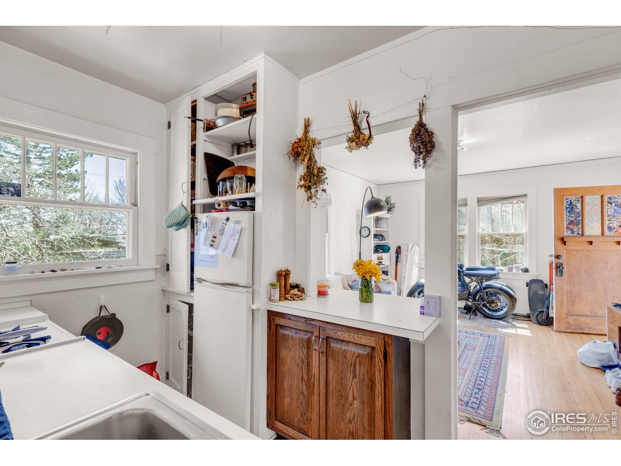 834-836 13th Street Boulder, CO 80302 - Photo 27 of 40 a living room with furniture and a window
