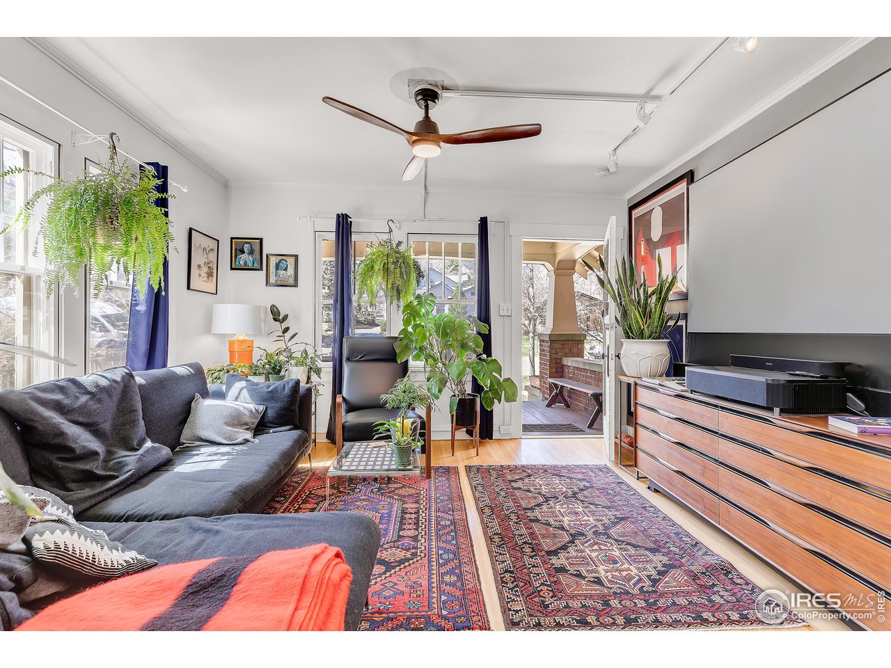 834-836 13th Street Boulder, CO 80302 - Photo 4 of 40 a living room with furniture and a potted plant