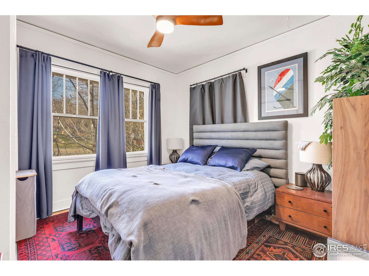 834-836 13th Street Boulder, CO 80302 - Photo 7 of 40 a bedroom with a bed and a window