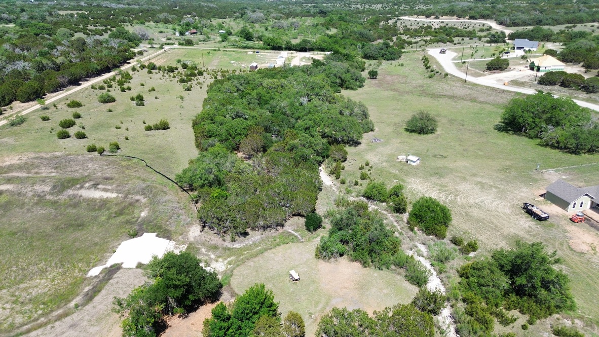 Lot 37 Garner Ranch Road Bertram, TX 78605 - Photo 4 of 9 an aerial view of a house with a yard
