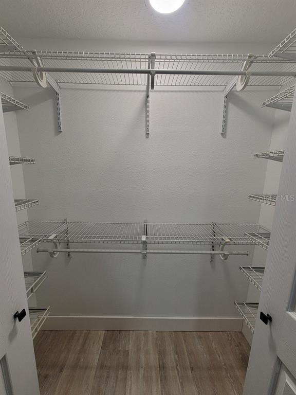 4944 Elkner Street New Port Richey, FL 34652 - Photo 14 of 24 a view of a room with racks on the wall