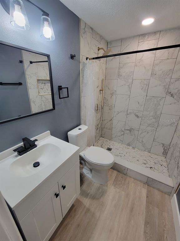 4944 Elkner Street New Port Richey, FL 34652 - Photo 15 of 24 a bathroom with a sink and mirror