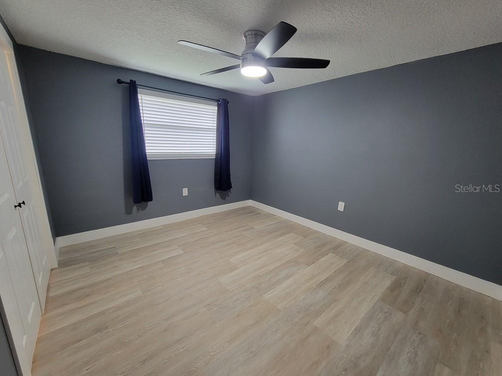 4944 Elkner Street New Port Richey, FL 34652 - Photo 17 of 24 a view of an empty room with a window