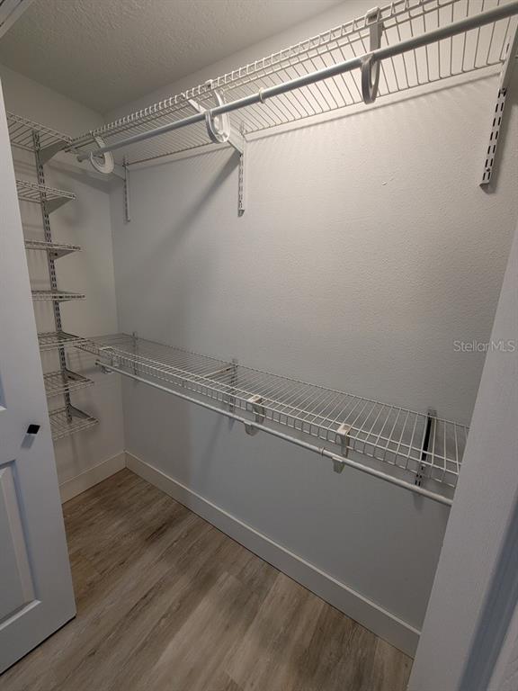 4944 Elkner Street New Port Richey, FL 34652 - Photo 19 of 24 a view of a room with racks on the wall