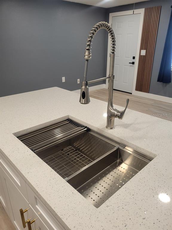 4944 Elkner Street New Port Richey, FL 34652 - Photo 9 of 24 a close view of a sink a counter space and utility room
