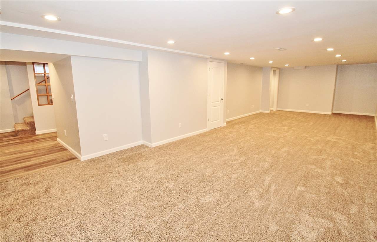 8372 Spring Creek Road Rockford, IL 61114 - Photo 20 of 25 a view of an empty room with wooden floor