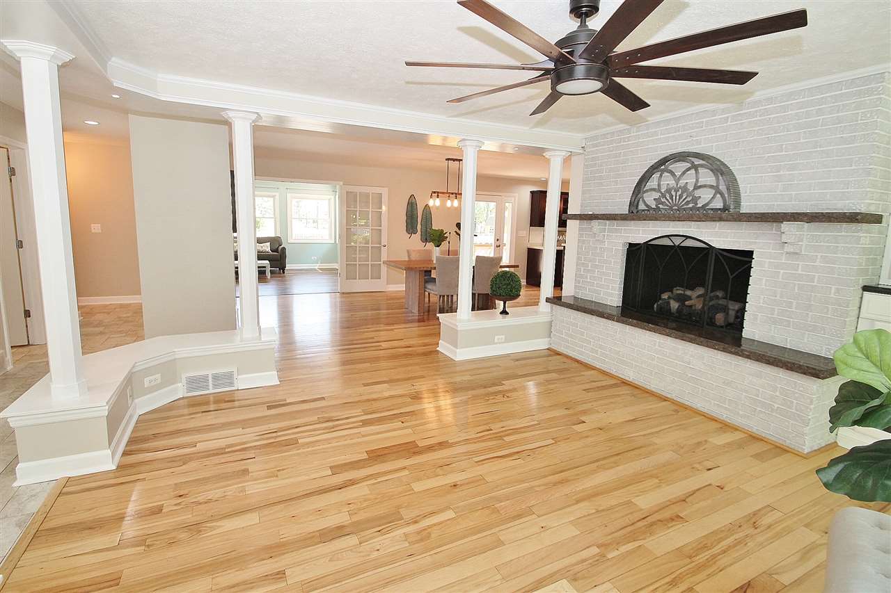 8372 Spring Creek Road Rockford, IL 61114 - Photo 4 of 25 a living room with furniture and a fireplace