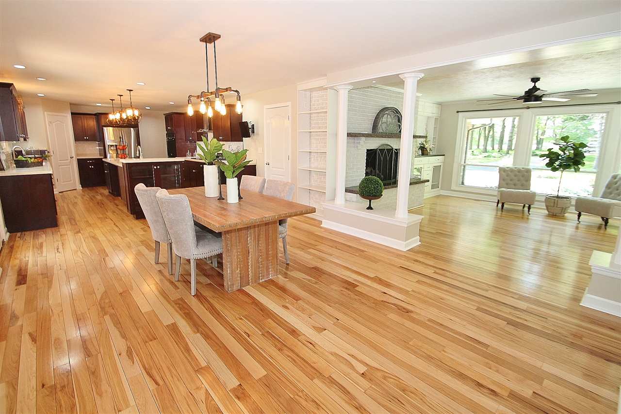 8372 Spring Creek Road Rockford, IL 61114 - Photo 6 of 25 a view of a dining room with furniture window and wooden floor