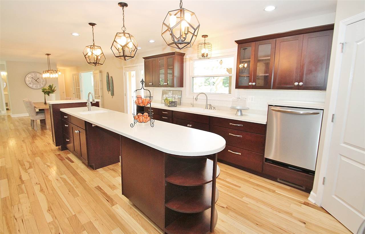 8372 Spring Creek Road Rockford, IL 61114 - Photo 10 of 25 a kitchen with sink and refrigerator