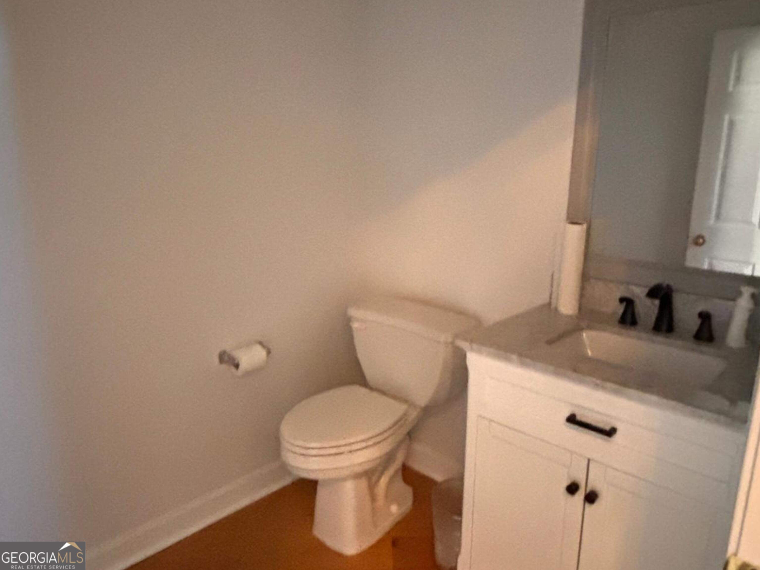 474 Fraser Street Southeast Atlanta, GA 30312 - Photo 13 of 21 a bathroom with a granite countertop toilet and a sink