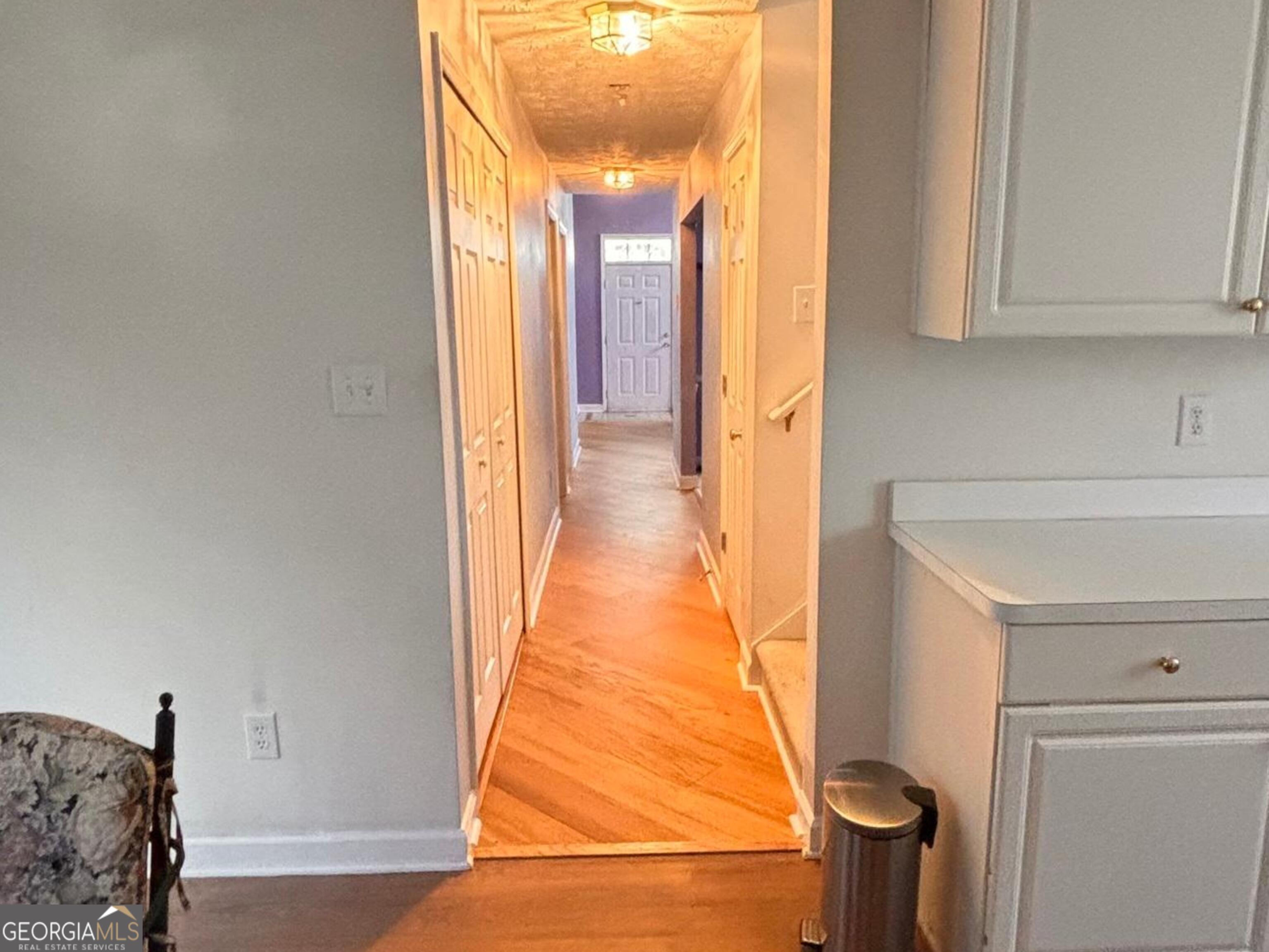 474 Fraser Street Southeast Atlanta, GA 30312 - Photo 15 of 21 a view of a hallway with wooden floor and cabinet
