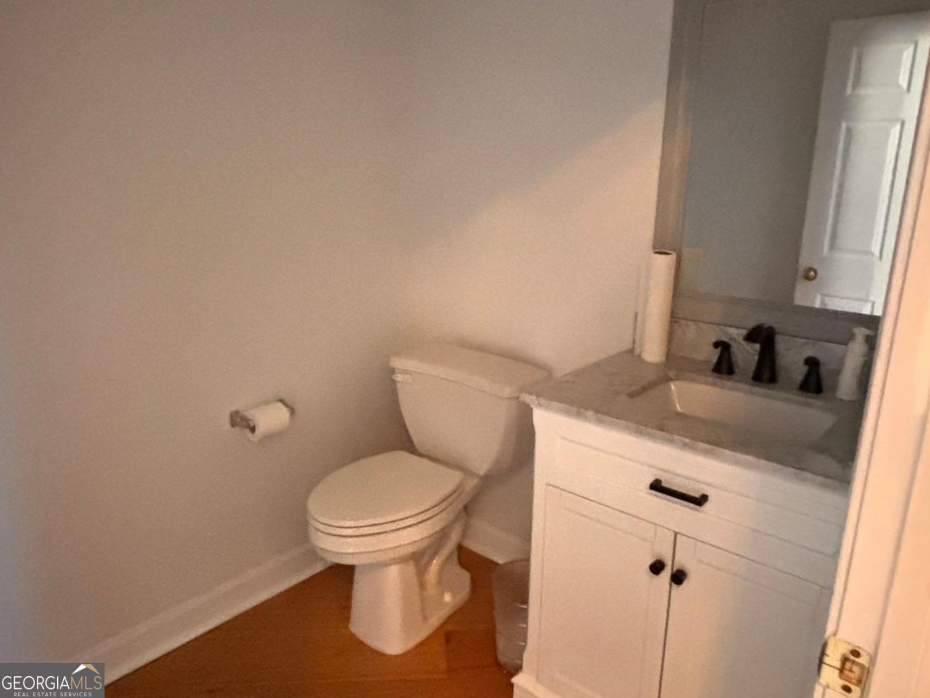 474 Fraser Street Southeast Atlanta, GA 30312 - Photo 16 of 21 a bathroom with a granite countertop toilet and a sink