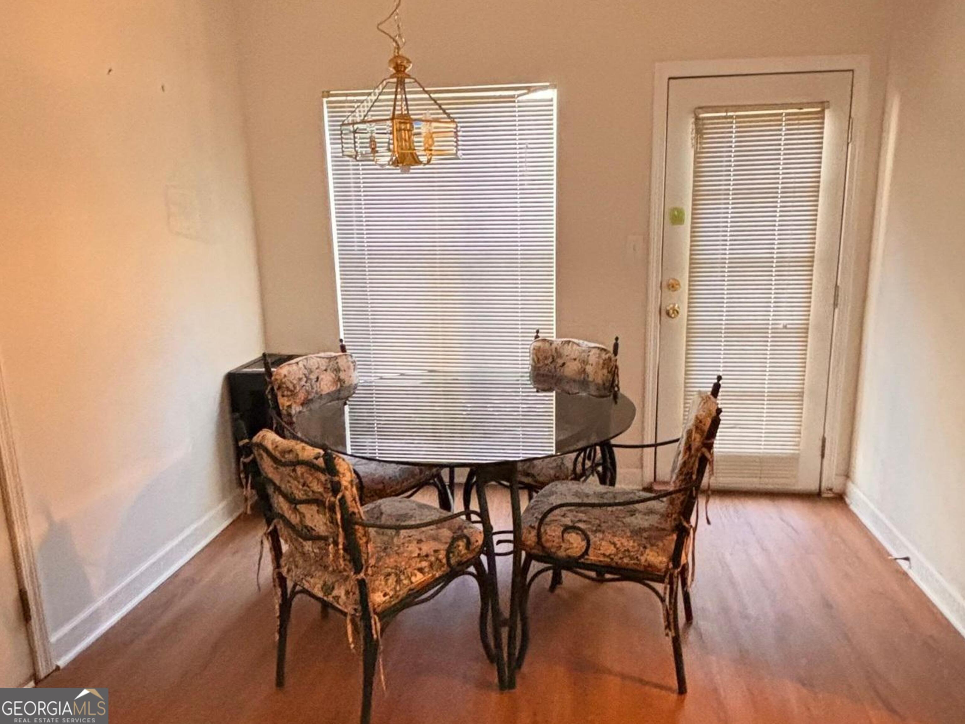 474 Fraser Street Southeast Atlanta, GA 30312 - Photo 19 of 21 a view of a dining room with furniture and wooden floor