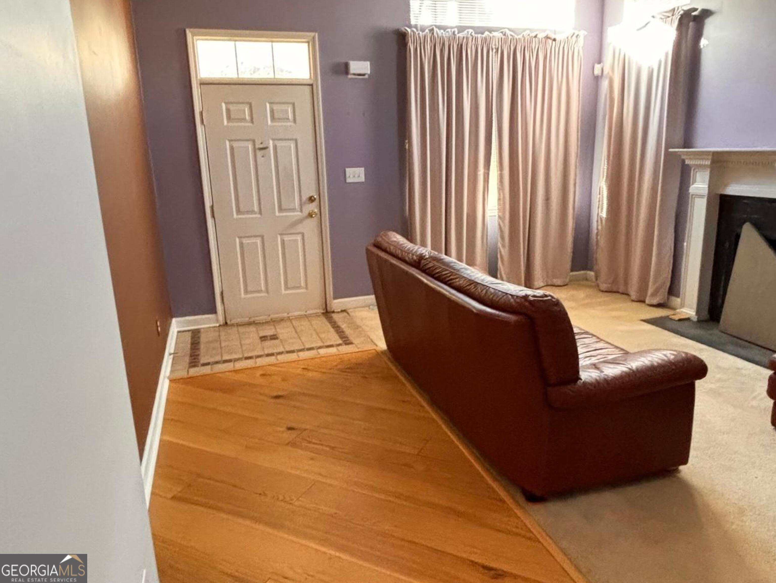 474 Fraser Street Southeast Atlanta, GA 30312 - Photo 10 of 21 a living room with furniture and a gate