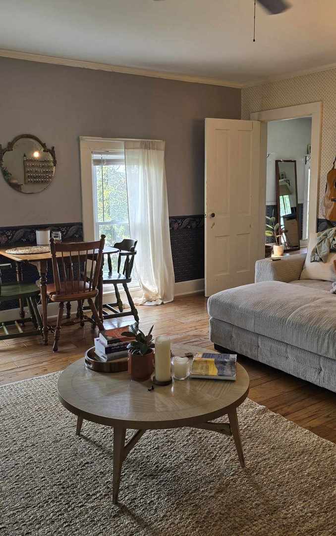 11718 Thayer Road Hebron, IL 60034 - Photo 6 of 14 a living room with furniture a table and a large window