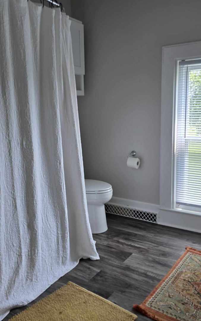 11718 Thayer Road Hebron, IL 60034 - Photo 8 of 14 a view of bathroom with bathtub and toilet