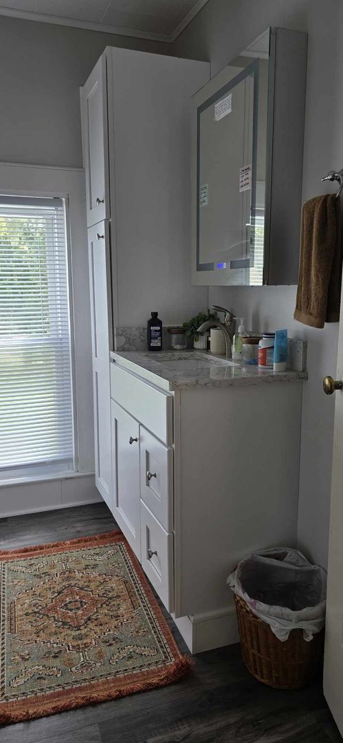 11718 Thayer Road Hebron, IL 60034 - Photo 9 of 14 a room with cabinets and a wooden floor