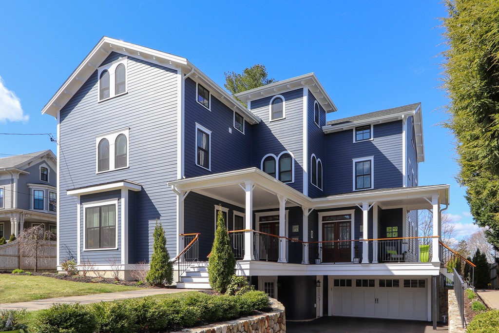 63 Herrick Road, Unit 2 Newton, MA 02459 - Photo 1 of 38 a front view of a house with a yard