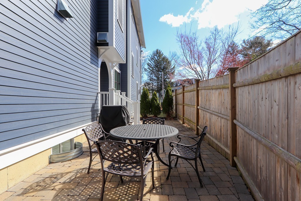 63 Herrick Road, Unit 2 Newton, MA 02459 - Photo 16 of 38 a view of a chairs and table in the balcony