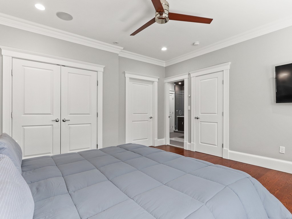 63 Herrick Road, Unit 2 Newton, MA 02459 - Photo 18 of 38 a view of a livingroom with a chandelier fan and windows