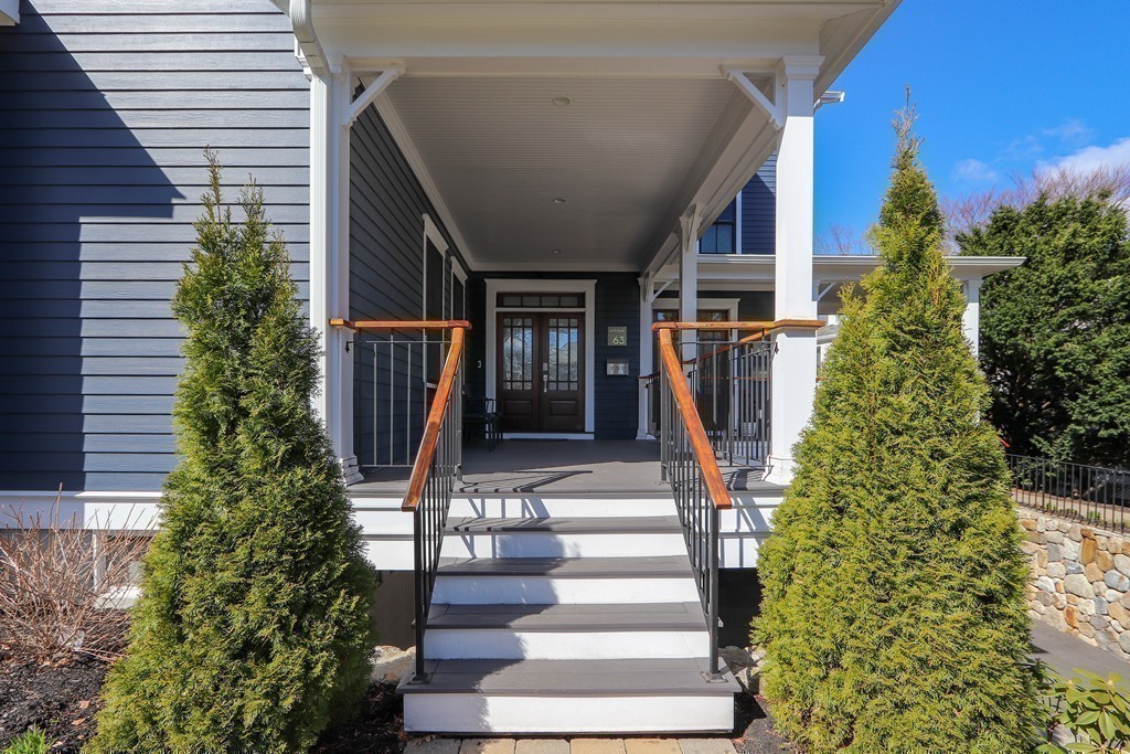 63 Herrick Road, Unit 2 Newton, MA 02459 - Photo 2 of 38 a view of house with outdoor space and trees