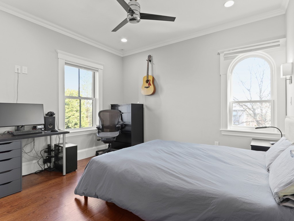 63 Herrick Road, Unit 2 Newton, MA 02459 - Photo 21 of 38 a bedroom with a bed and a large window