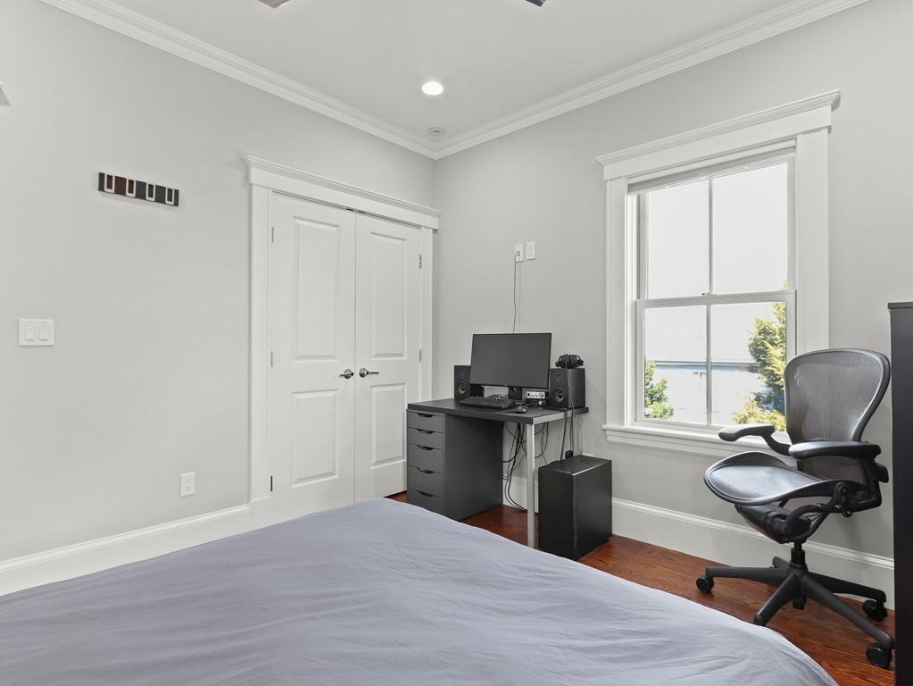 63 Herrick Road, Unit 2 Newton, MA 02459 - Photo 22 of 38 a view of a workspace with furniture and a window