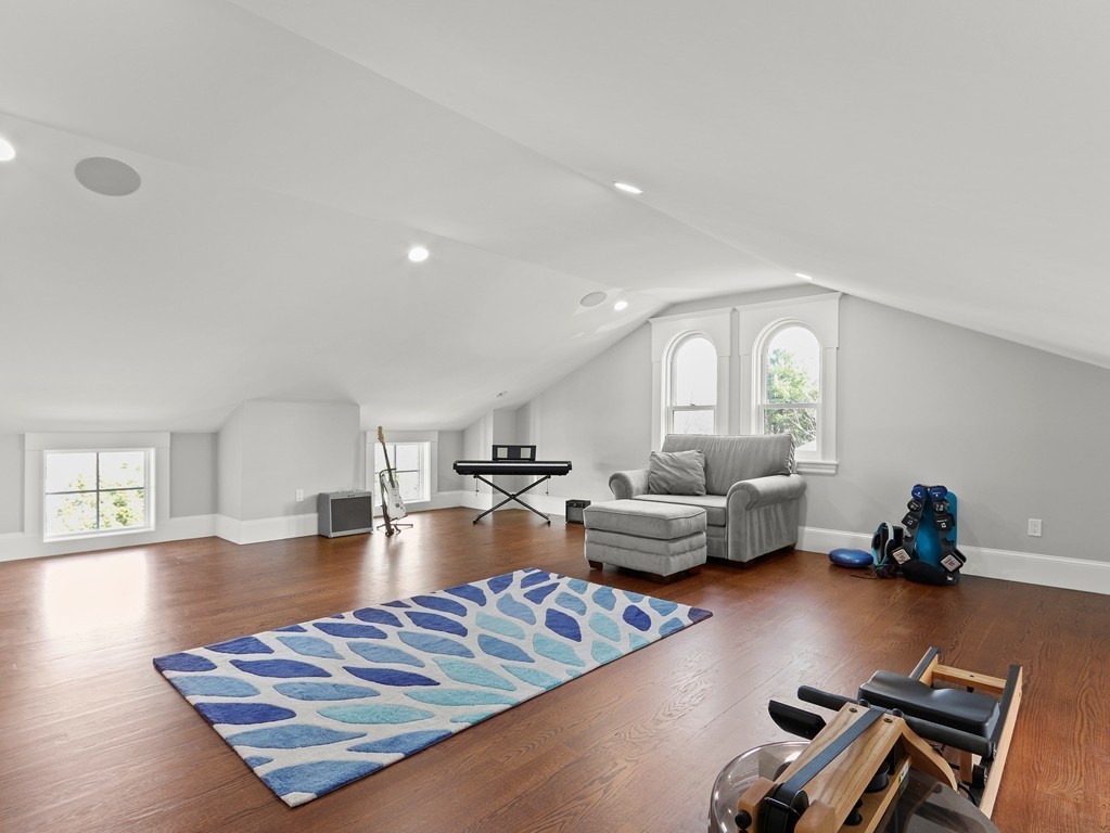 63 Herrick Road, Unit 2 Newton, MA 02459 - Photo 27 of 38 a living room with furniture and a wooden floor