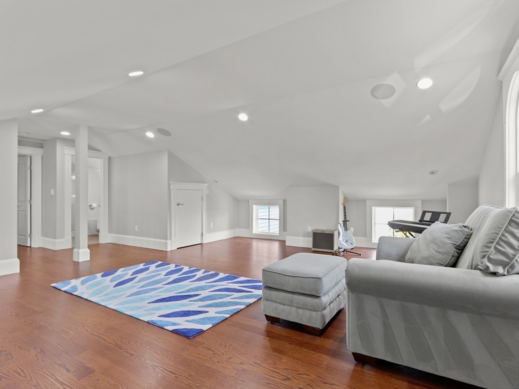 63 Herrick Road, Unit 2 Newton, MA 02459 - Photo 28 of 38 a living room with furniture and a wooden floor