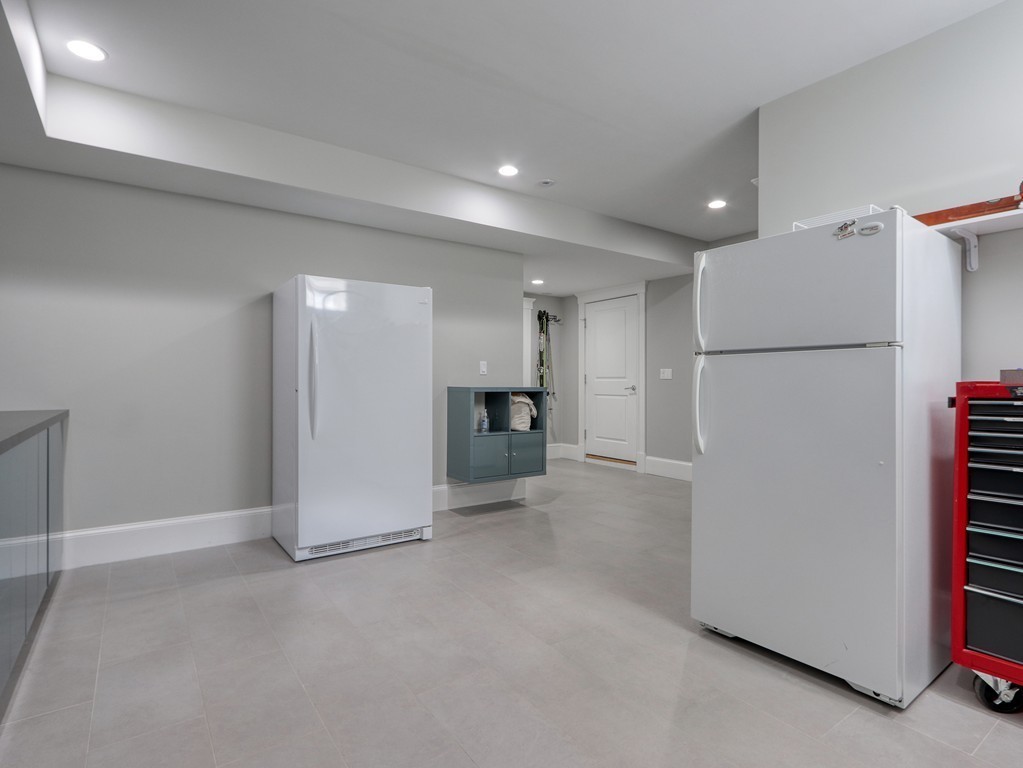 63 Herrick Road, Unit 2 Newton, MA 02459 - Photo 32 of 38 a view of a kitchen with a refrigerator and a refrigerator