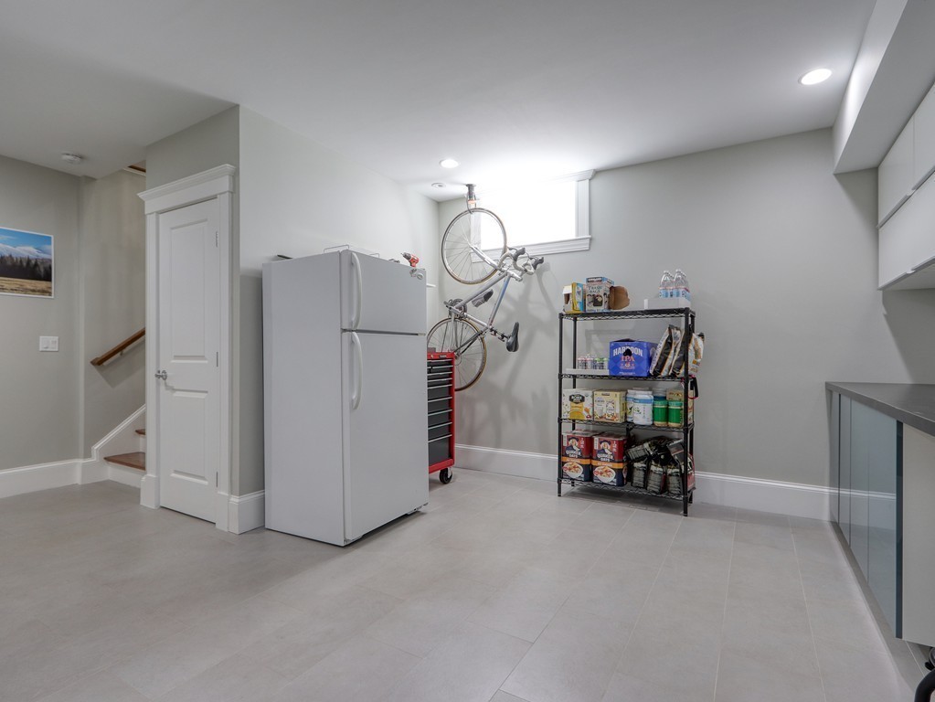 63 Herrick Road, Unit 2 Newton, MA 02459 - Photo 33 of 38 a view of a storage & utility room with toys