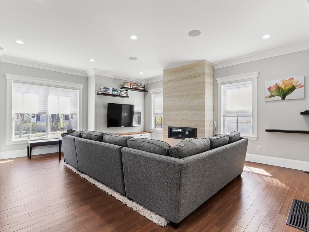 63 Herrick Road, Unit 2 Newton, MA 02459 - Photo 8 of 38 a living room with furniture and a fireplace