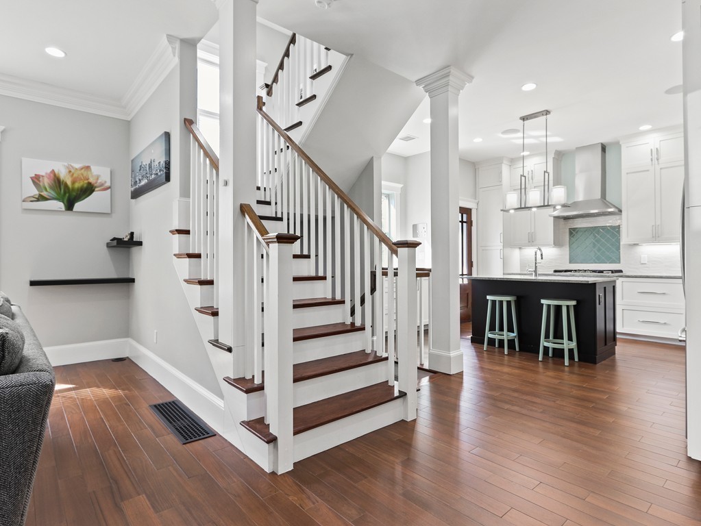 63 Herrick Road, Unit 2 Newton, MA 02459 - Photo 10 of 38 a view of entryway and kitchen with wooden floor
