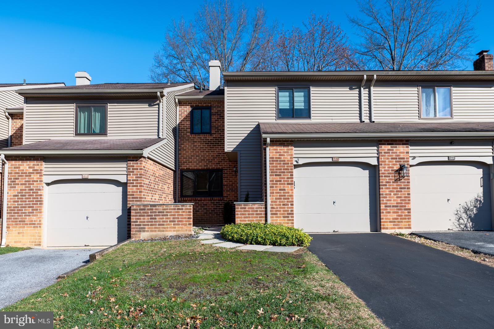 a front view of a house with a garage