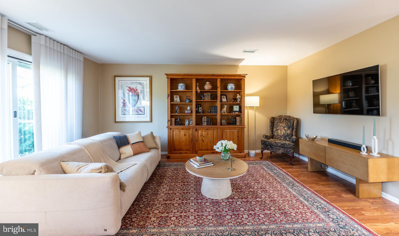 204 Camsten Court Chesterbrook, PA 19087 - Photo 11 of 56 a living room with furniture a rug and a flat screen tv
