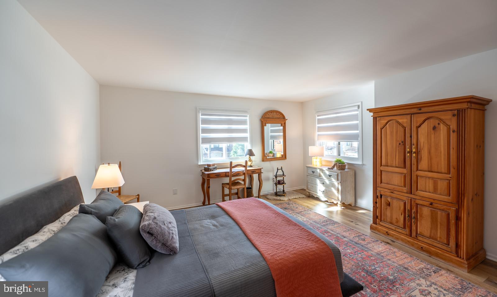 204 Camsten Court Chesterbrook, PA 19087 - Photo 34 of 56 a bedroom with a bed and a dresser with mirror