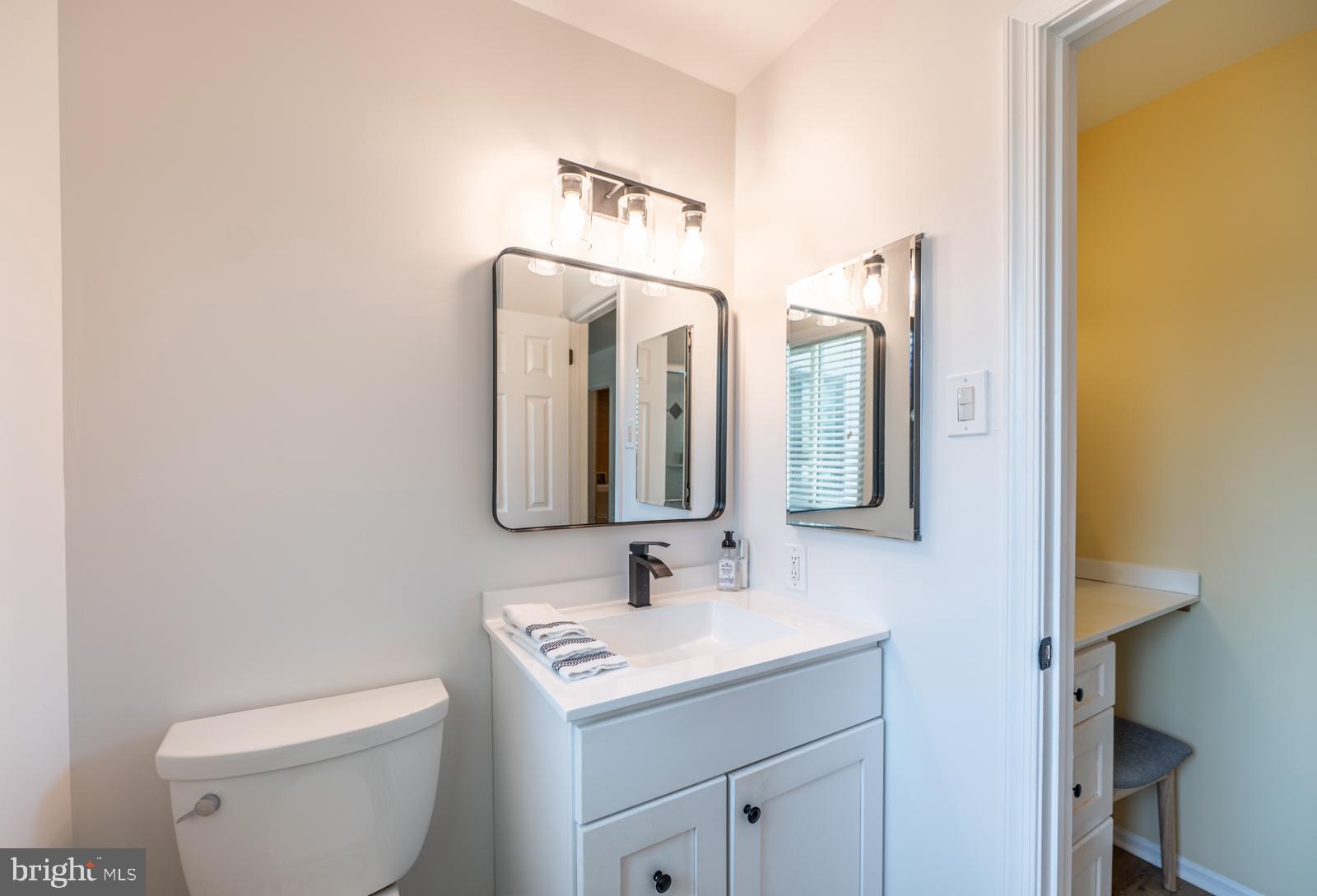 204 Camsten Court Chesterbrook, PA 19087 - Photo 41 of 56 a bathroom with a toilet sink and mirror