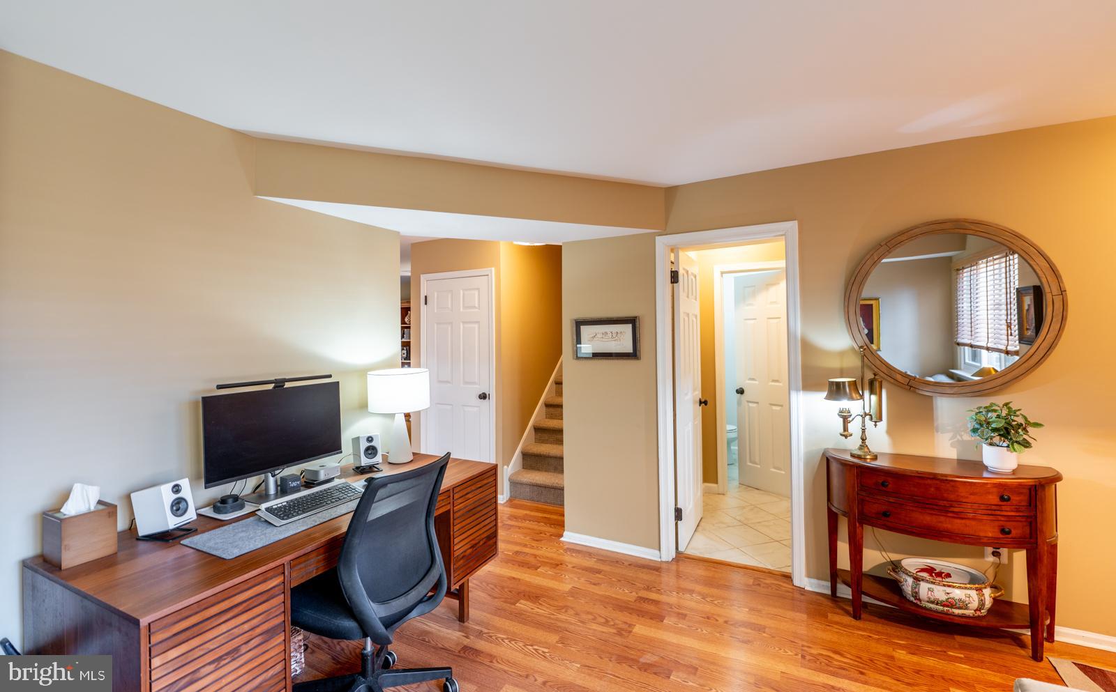 204 Camsten Court Chesterbrook, PA 19087 - Photo 8 of 56 a living room with furniture a flat screen tv and a mirror