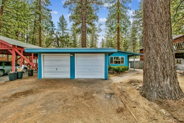 a view of a house with a tree in the background