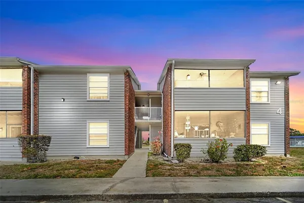a view of a livingroom with furniture and windows