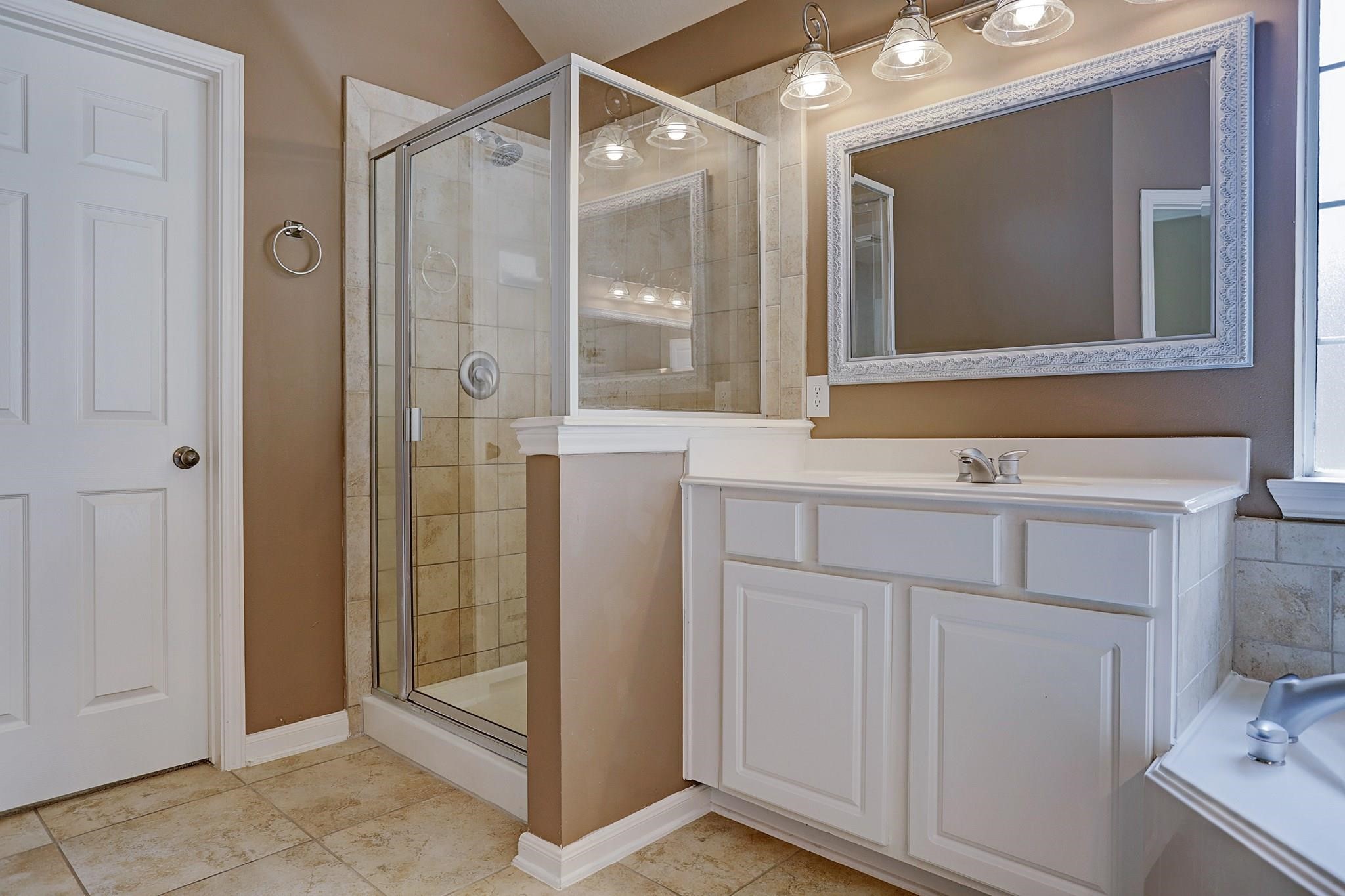 2118 Great Prairie Lane Katy, TX 77494 - Photo 17 of 24 a bathroom with a sink and mirror