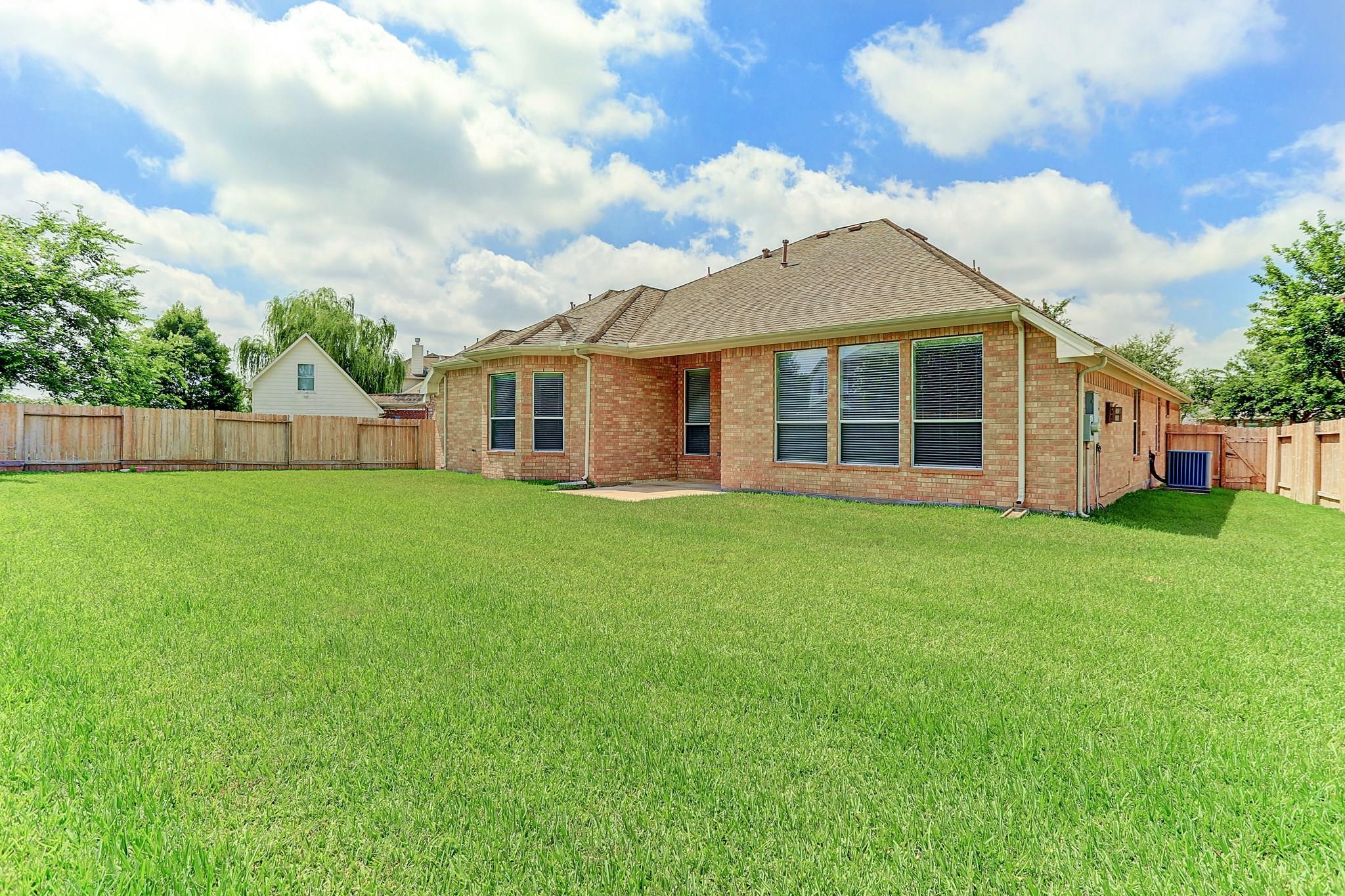2118 Great Prairie Lane Katy, TX 77494 - Photo 24 of 24 a view of a house with a big yard and large tree