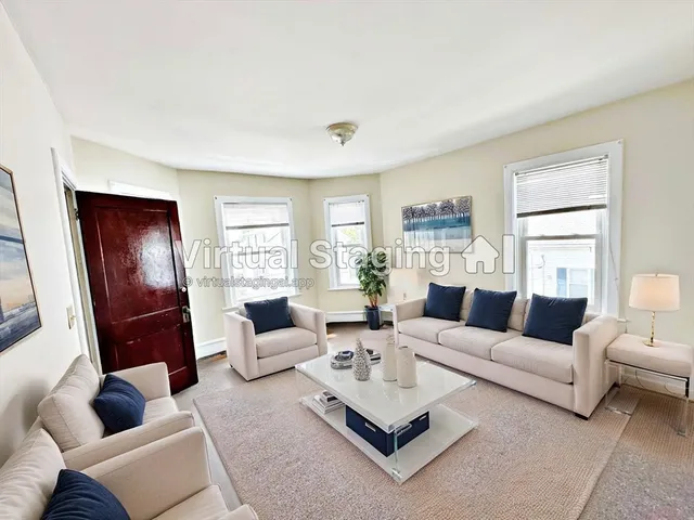 a kitchen with a refrigerator and a sink