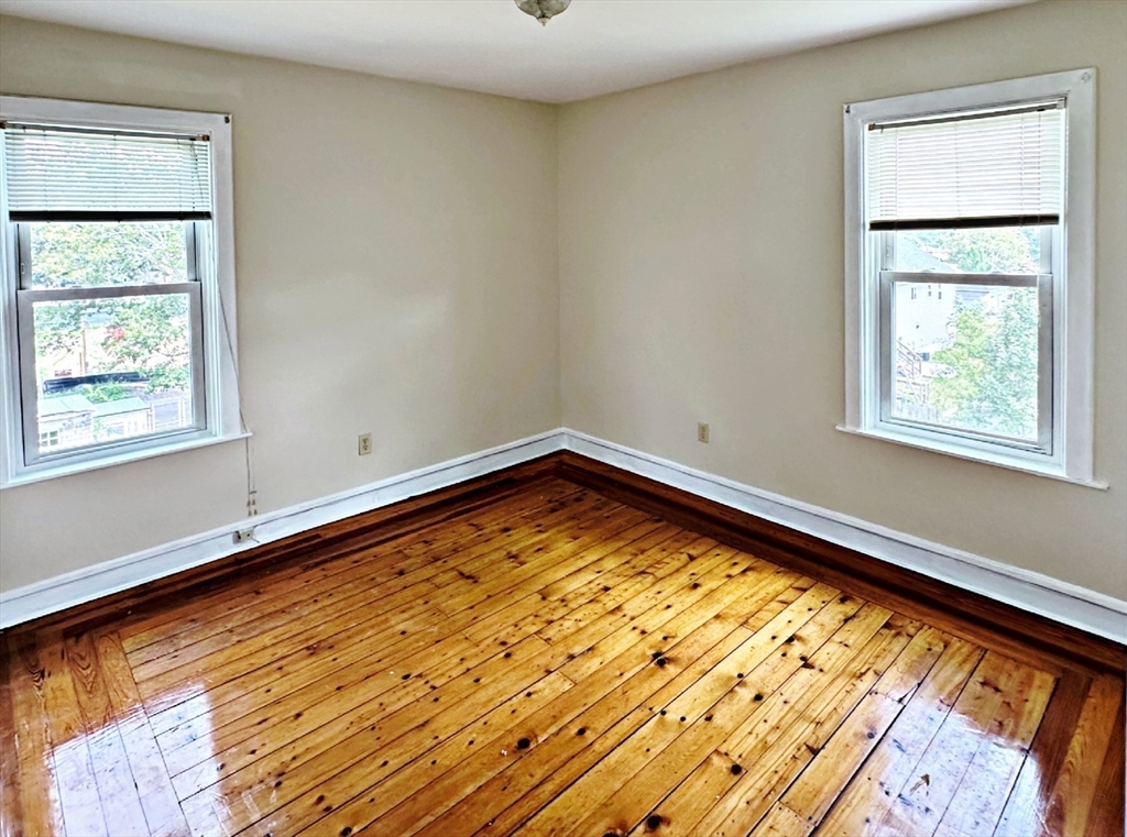 528 Lawton Street, Unit 3 Fall River, MA 02721 - Photo 16 of 22 a view of a room with wooden floor and a window