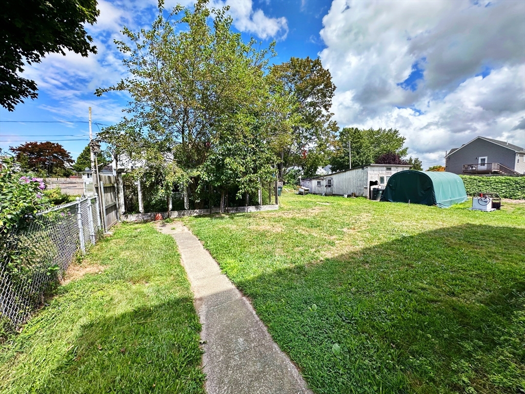 528 Lawton Street, Unit 3 Fall River, MA 02721 - Photo 5 of 22 a view of a garden with large trees