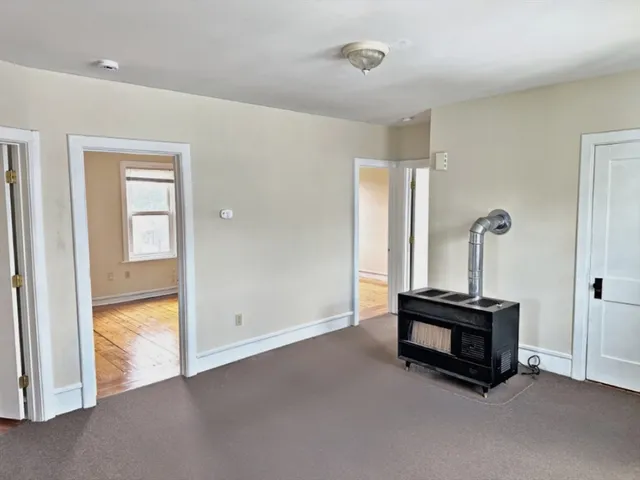 a view of a dining room with furniture and window