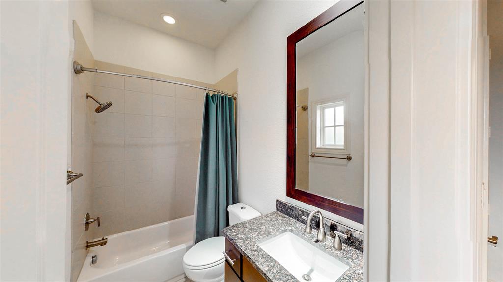 620 South Pearl Expressway Dallas, TX 75201 - Photo 15 of 33 a bathroom with a granite countertop sink toilet and shower