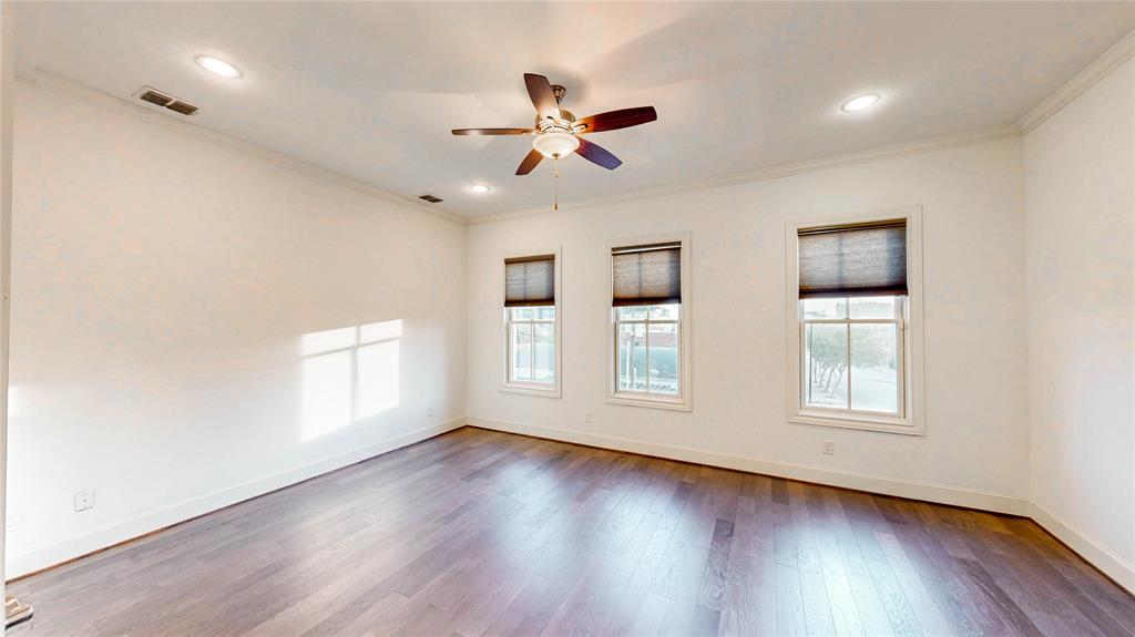 620 South Pearl Expressway Dallas, TX 75201 - Photo 16 of 33 a view of an empty room with wooden floor and window