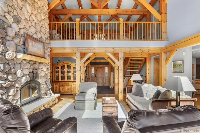 a view of a patio with couches table and chairs and potted plants